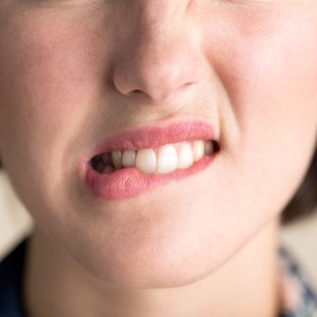 pap smear test woman worried biting lip