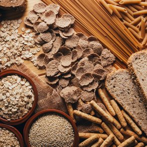 Wooden table full of fiber-rich whole foods, perfect for a balanced diet