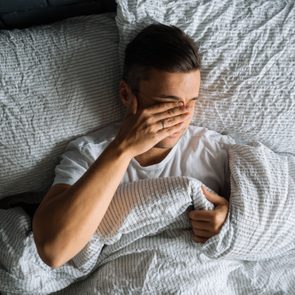 man trying to sleep in bed