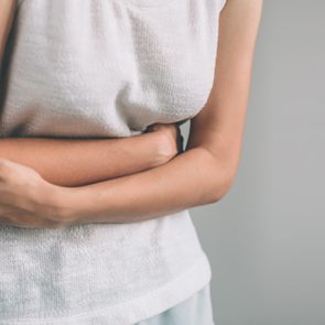 woman bloated holding stomach