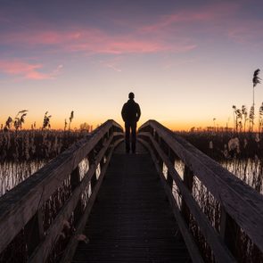 man looking at the sunset