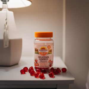 melatonin gummies on night stand with lamp