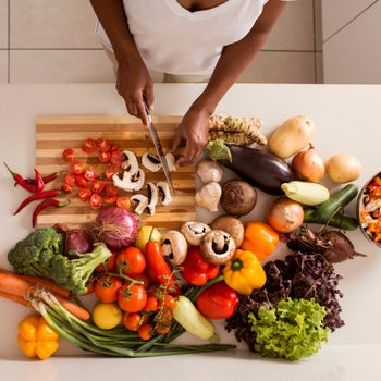 woman chopping vegetables in the kitchen