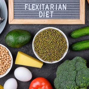 A set of products for a flexible diet. Felt plate with the inscription, a circle of vegetables, cereals and fish. Proper nutrition.