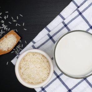 Milk and rice on the black table