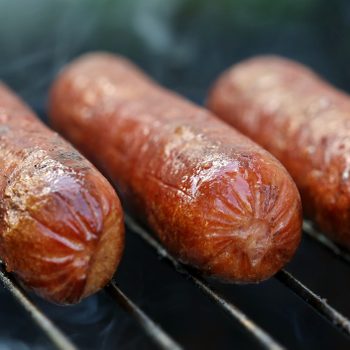 Hot dogs on the grill in the summer time