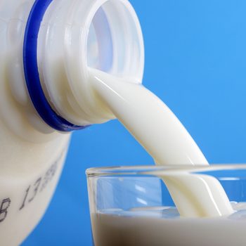 Pouring Milk Into Glass